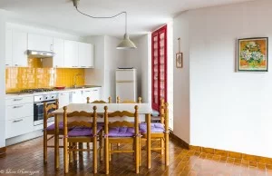 Yellow kitchen with table and chairs
